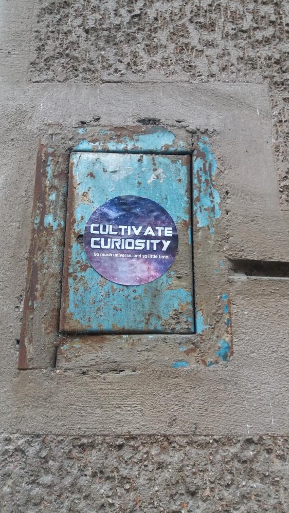 A sign saying cultivate curiosity