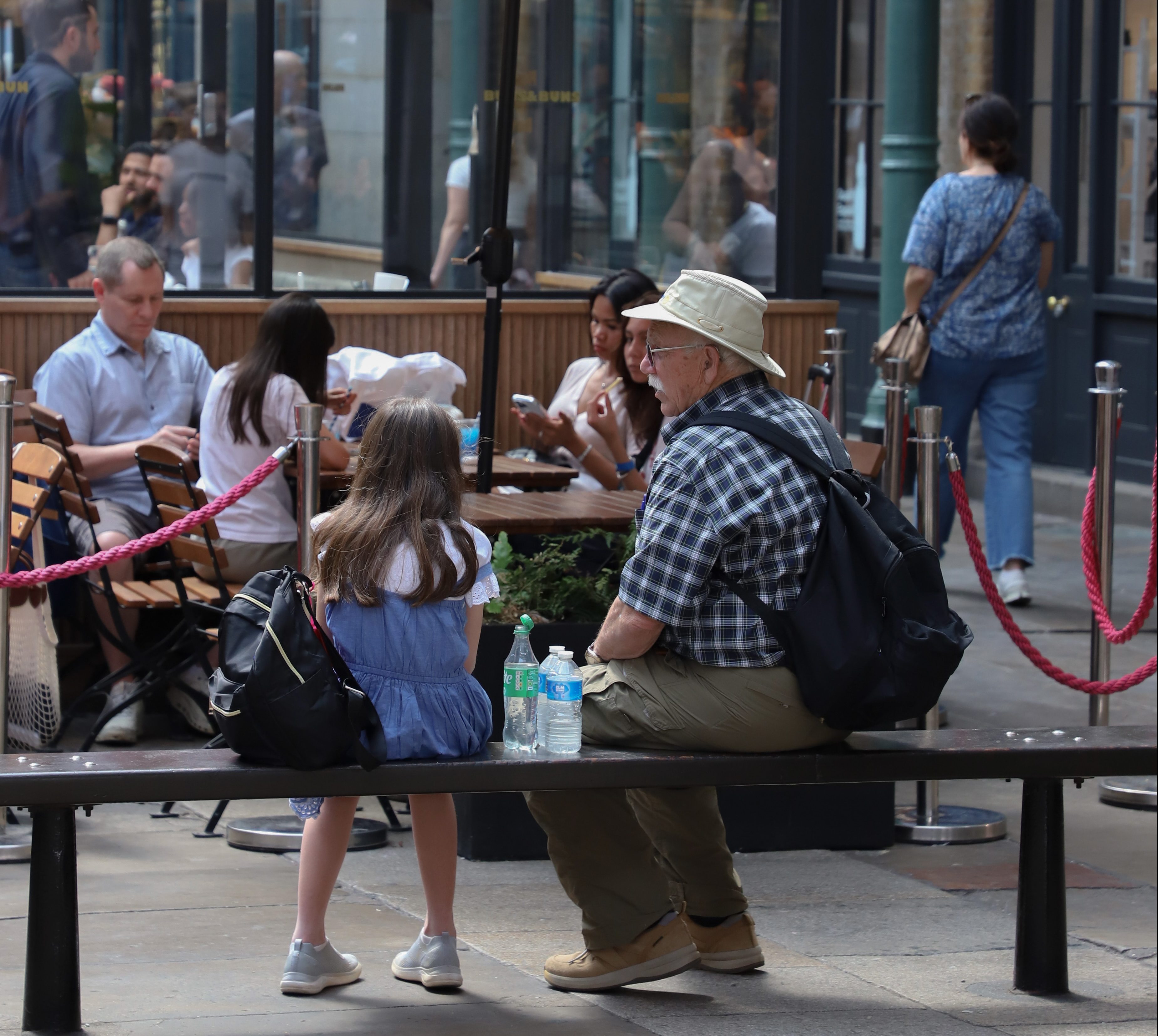 Older man and little girl sit