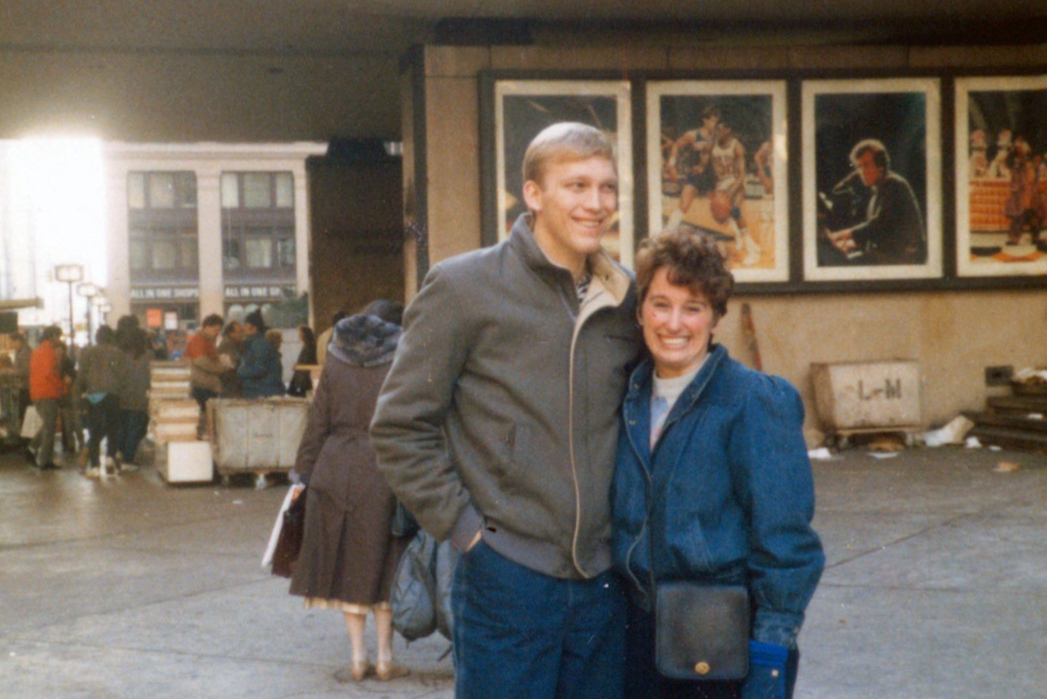 Chris and Jon in New York when they first met. Smiling. Arm and arm.