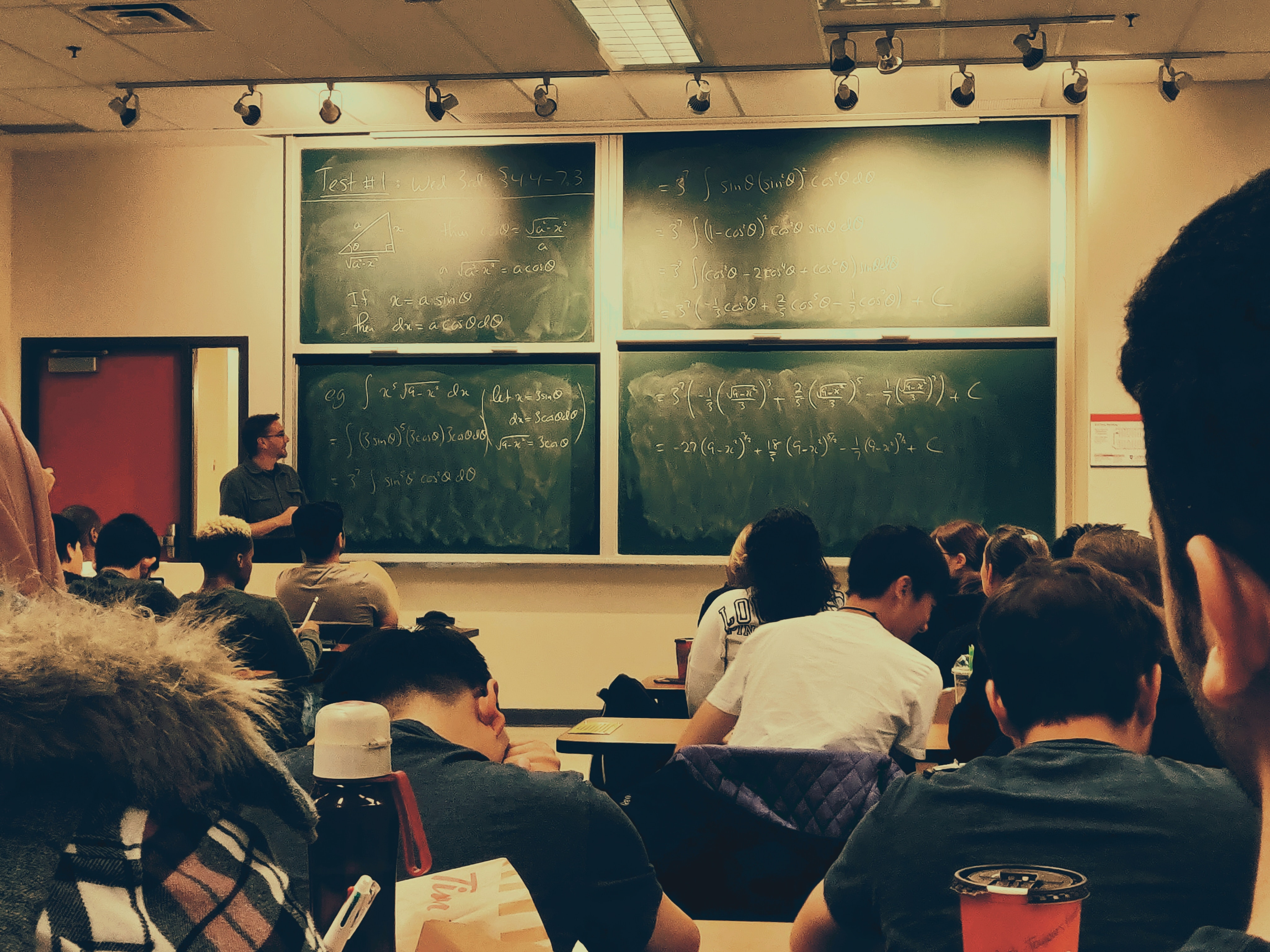 Pupils in a schoolroom having a maths class