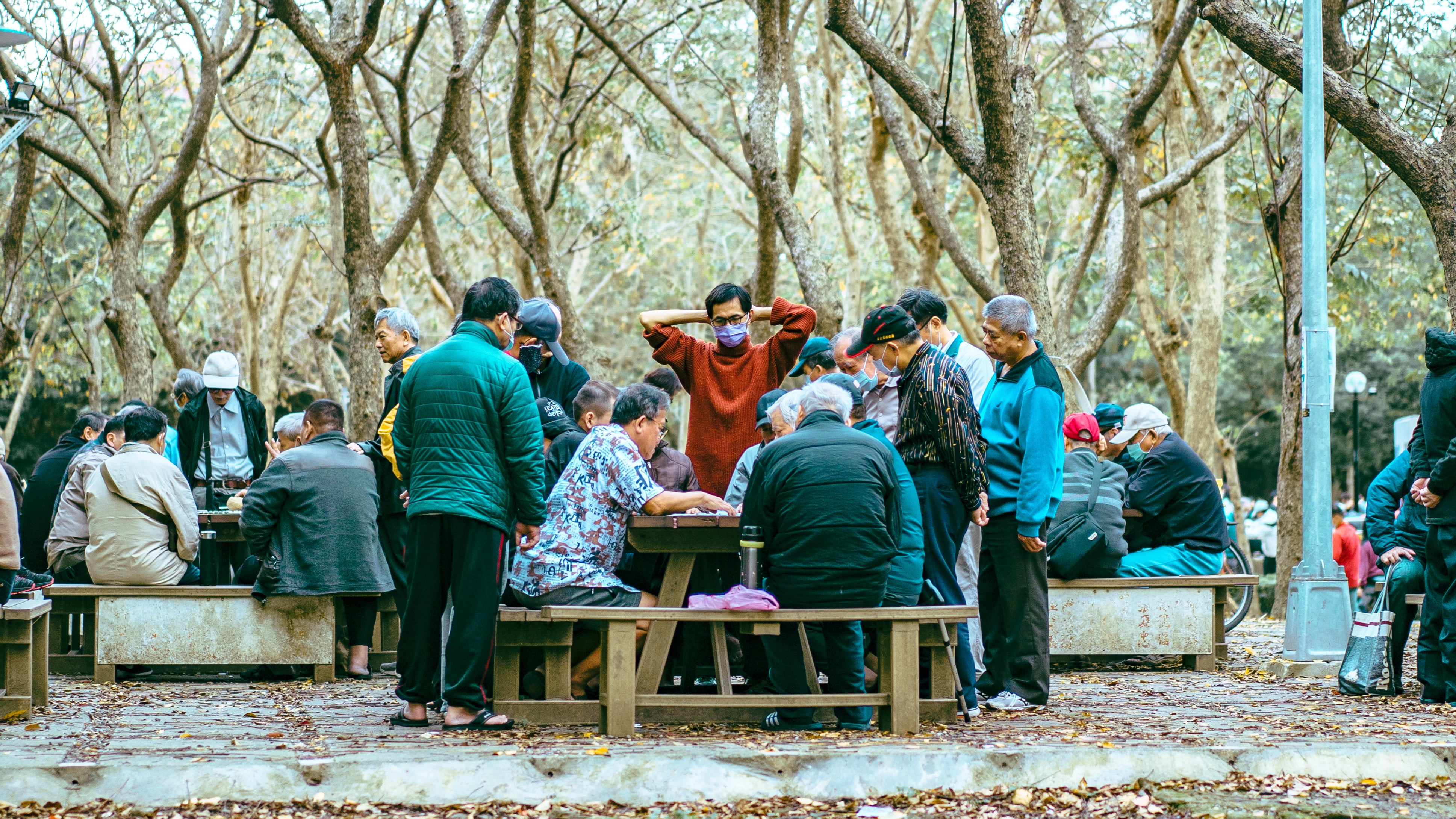 Taiwanese men talking around a table