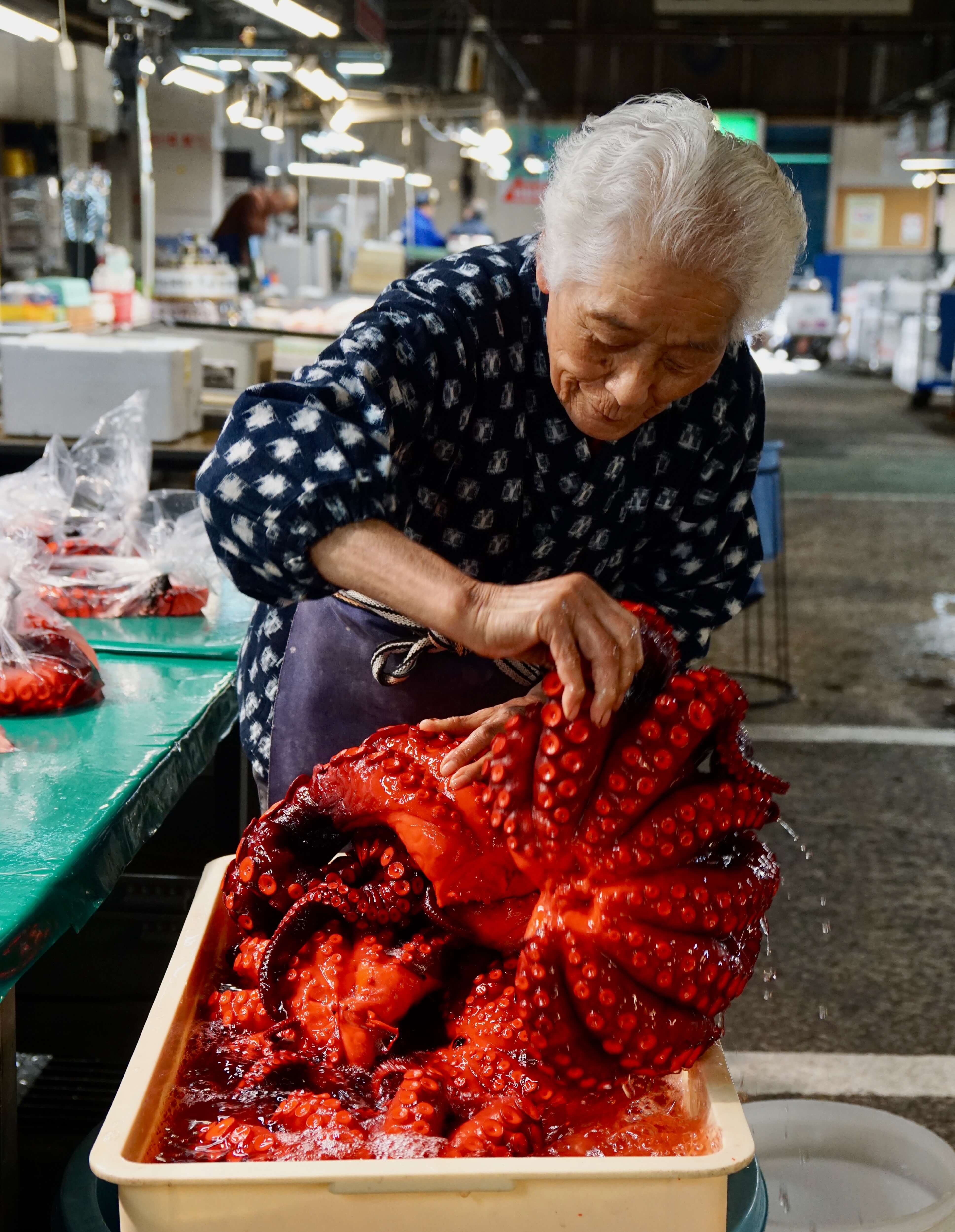 Much older Japanese woman with an octopus
