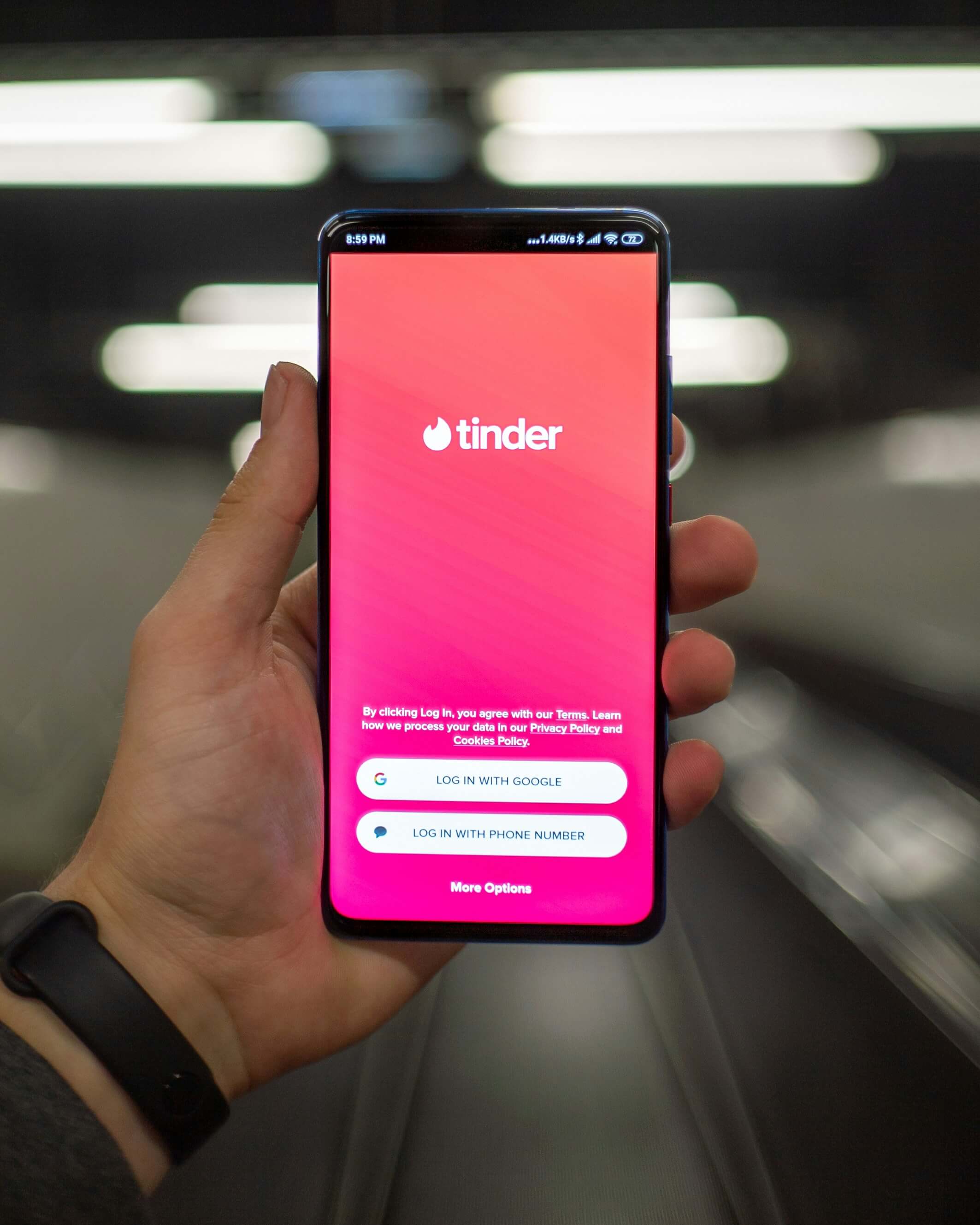 A screen showing Tinder log in