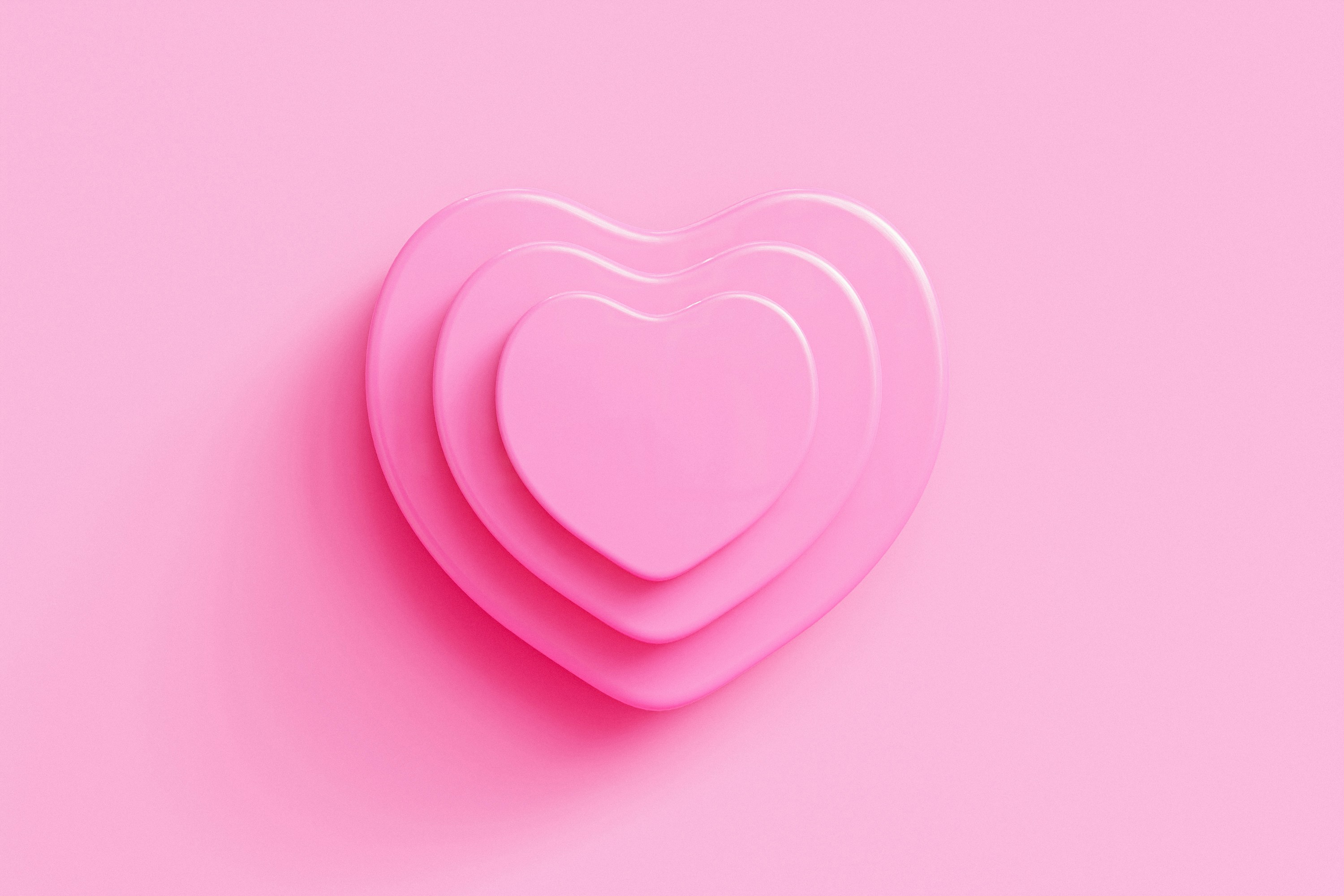 Pink hearts on a pink background