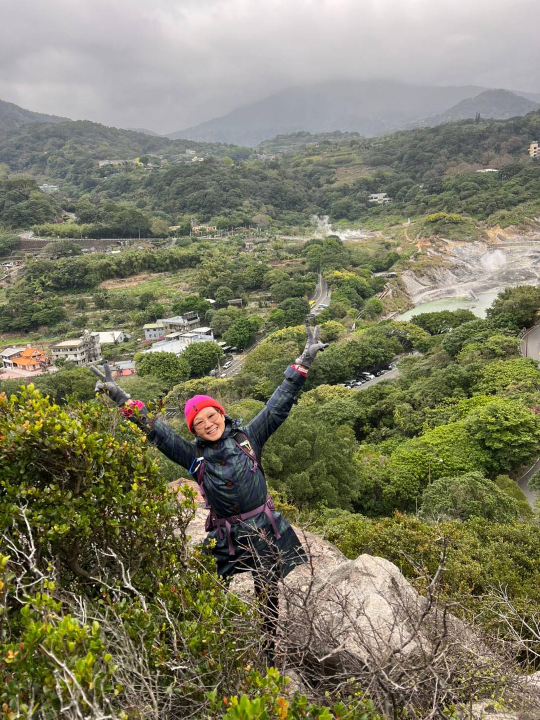 Mei-Ju looking joyful up a mountain