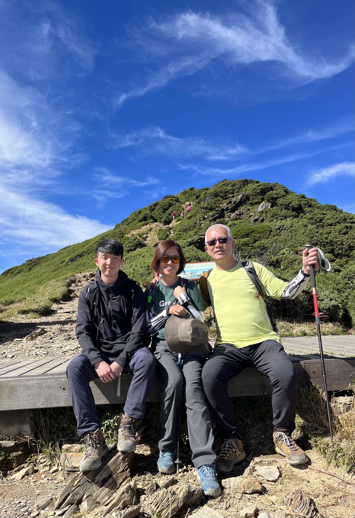 Kris with his wife and son hiking
