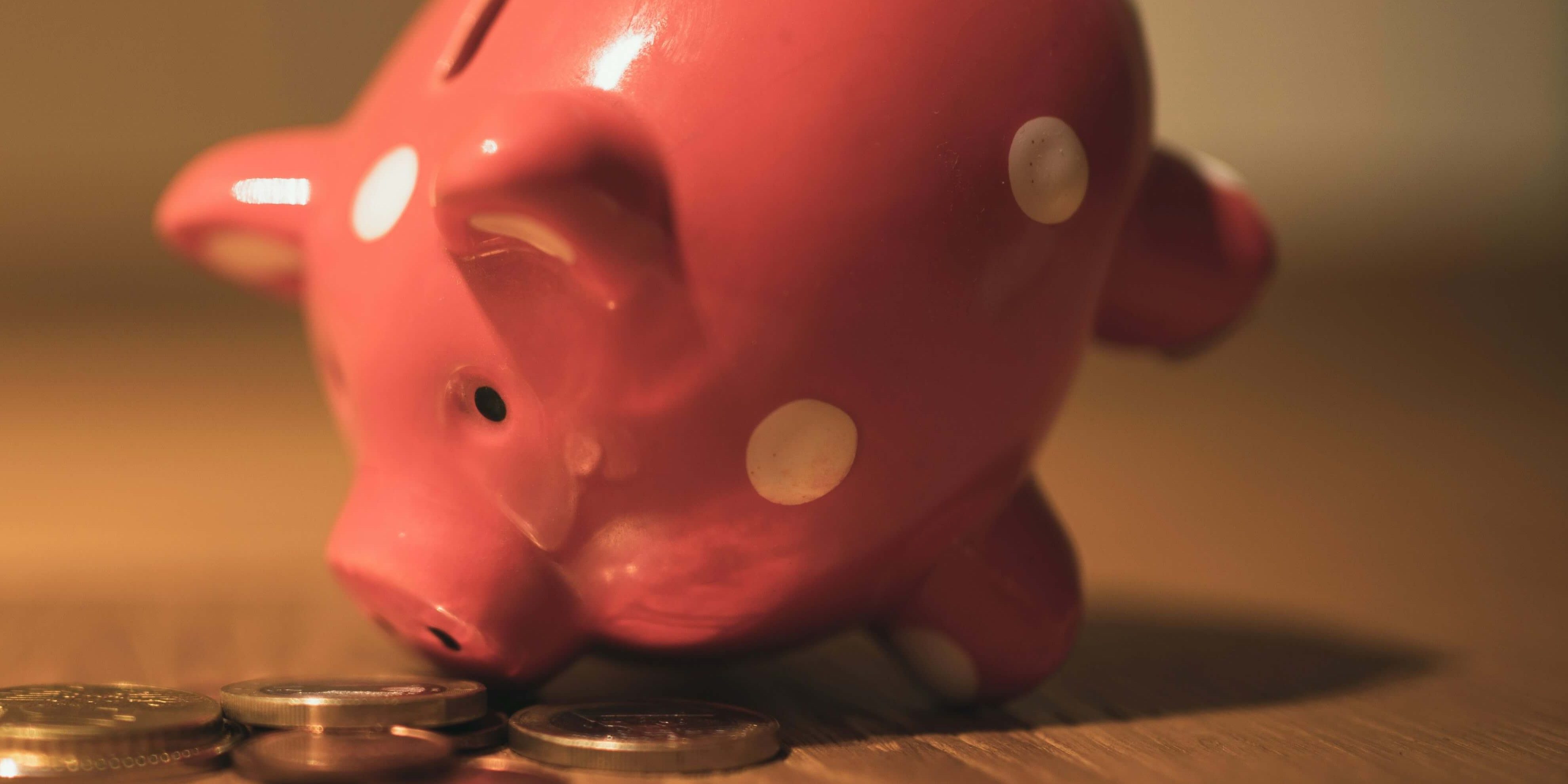Piggy bank looking at coins