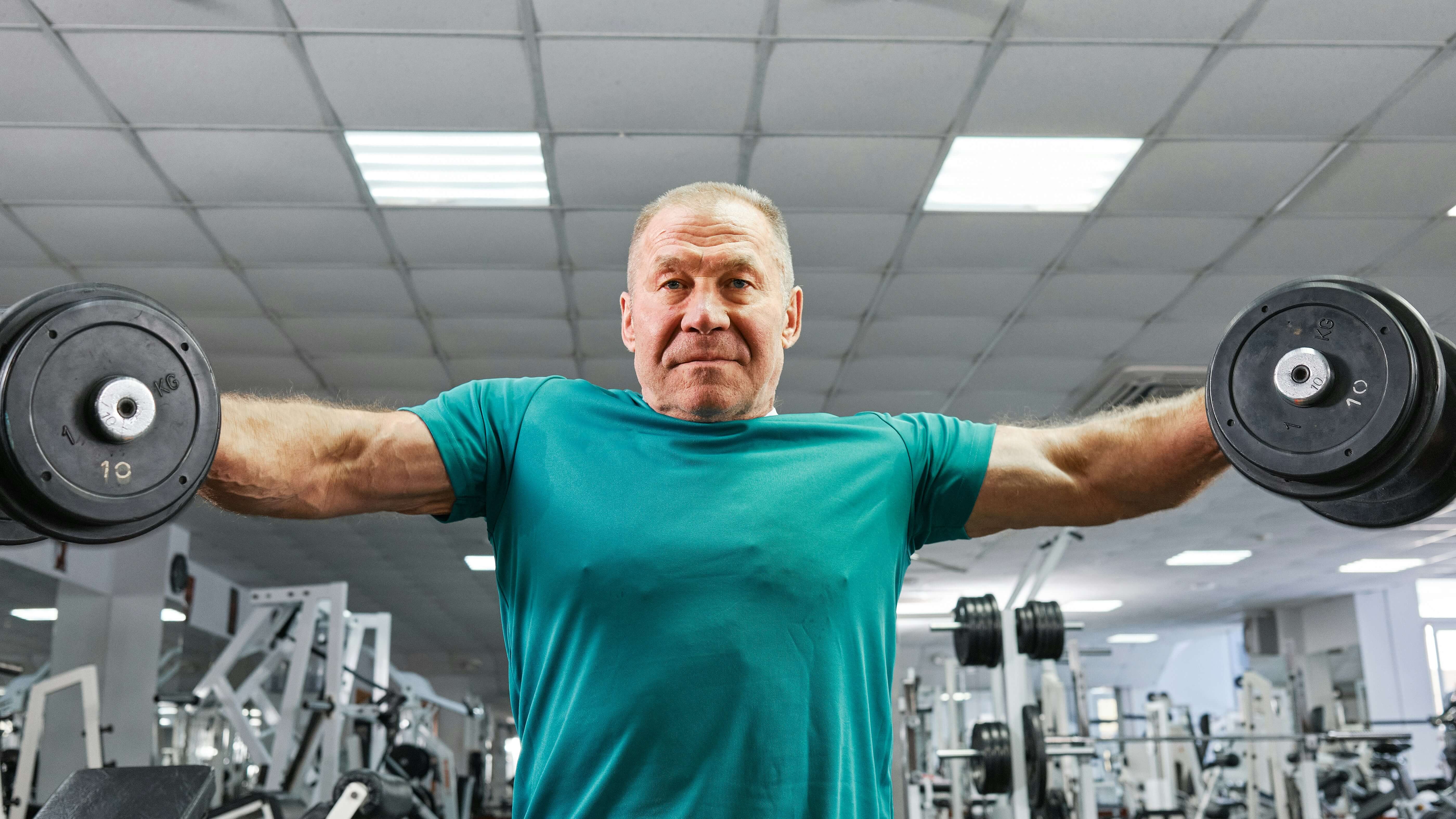 Man lifting very heavy free weights