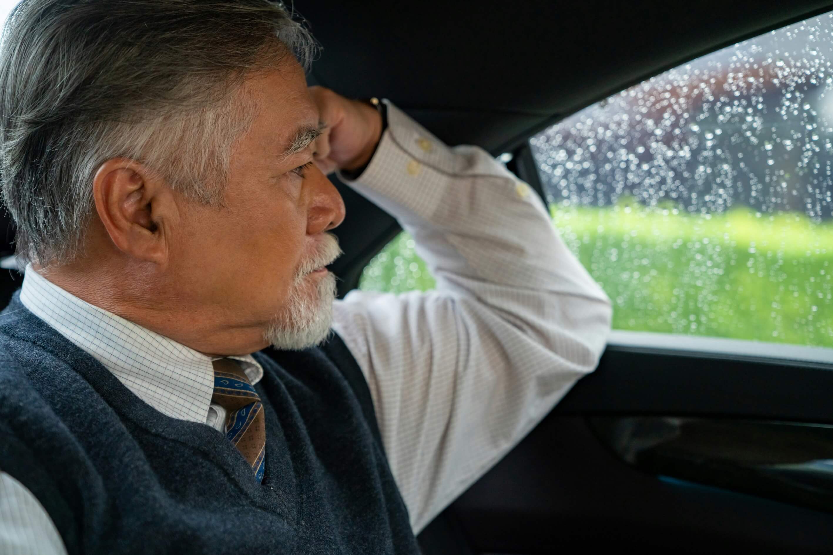 Older man in a taxi