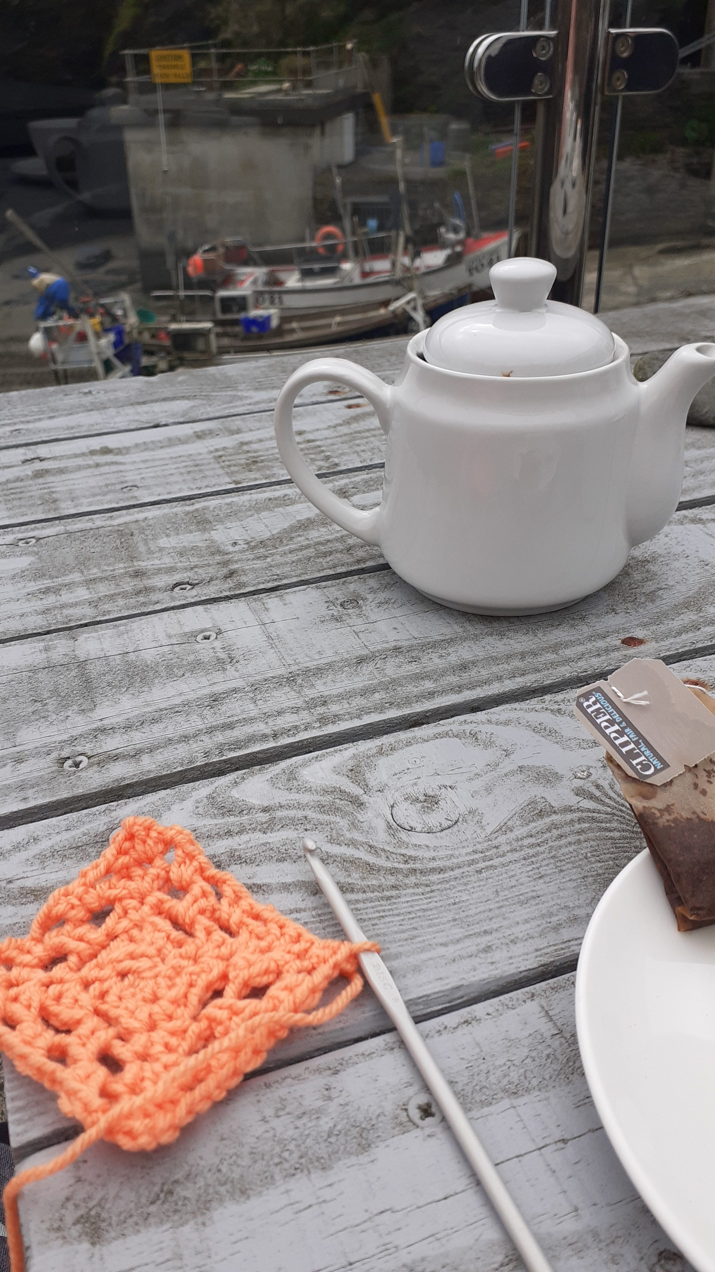 Teapor and orange crochet square