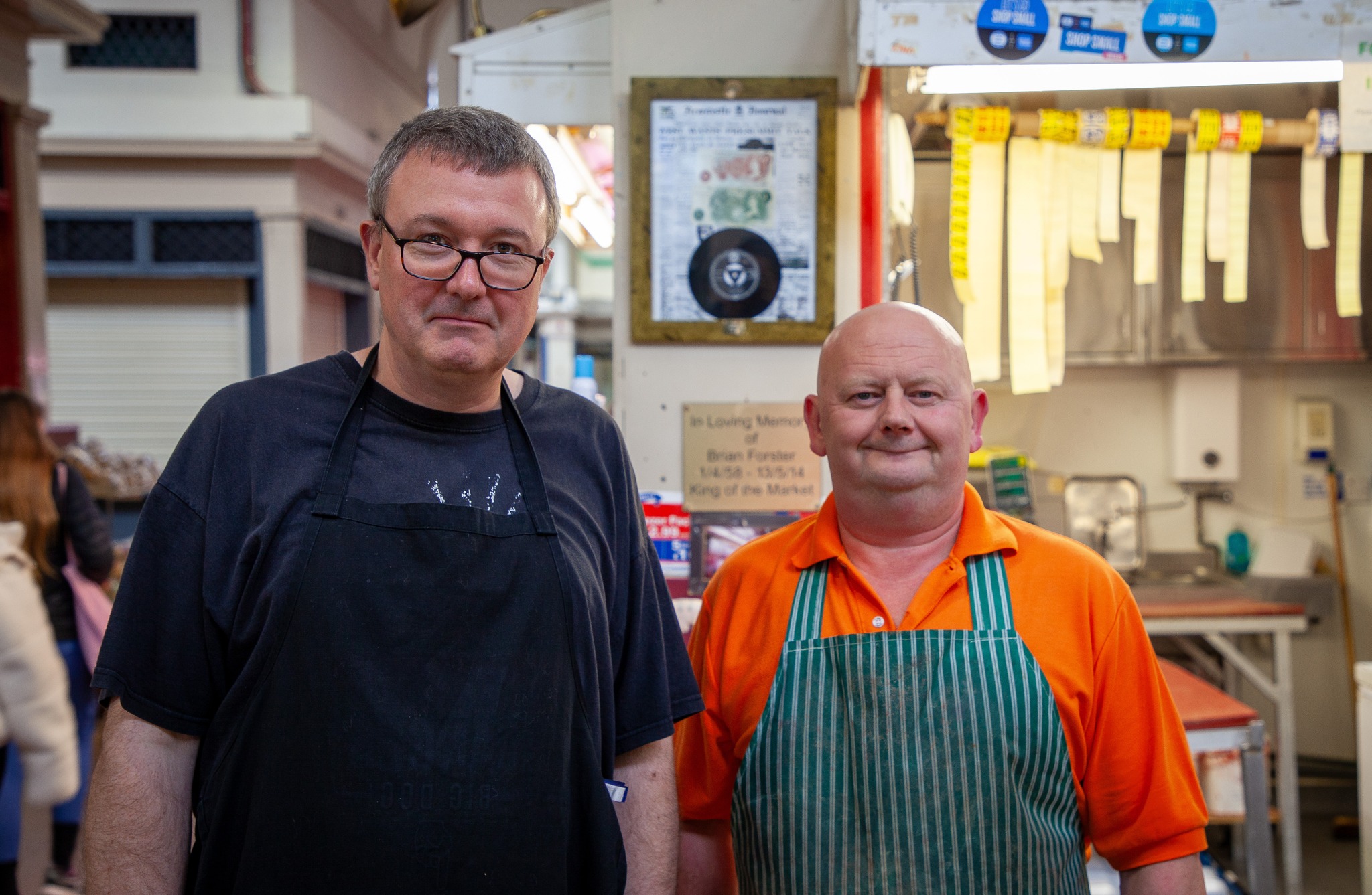 Two male traders looking at the camera in the Grainger Market