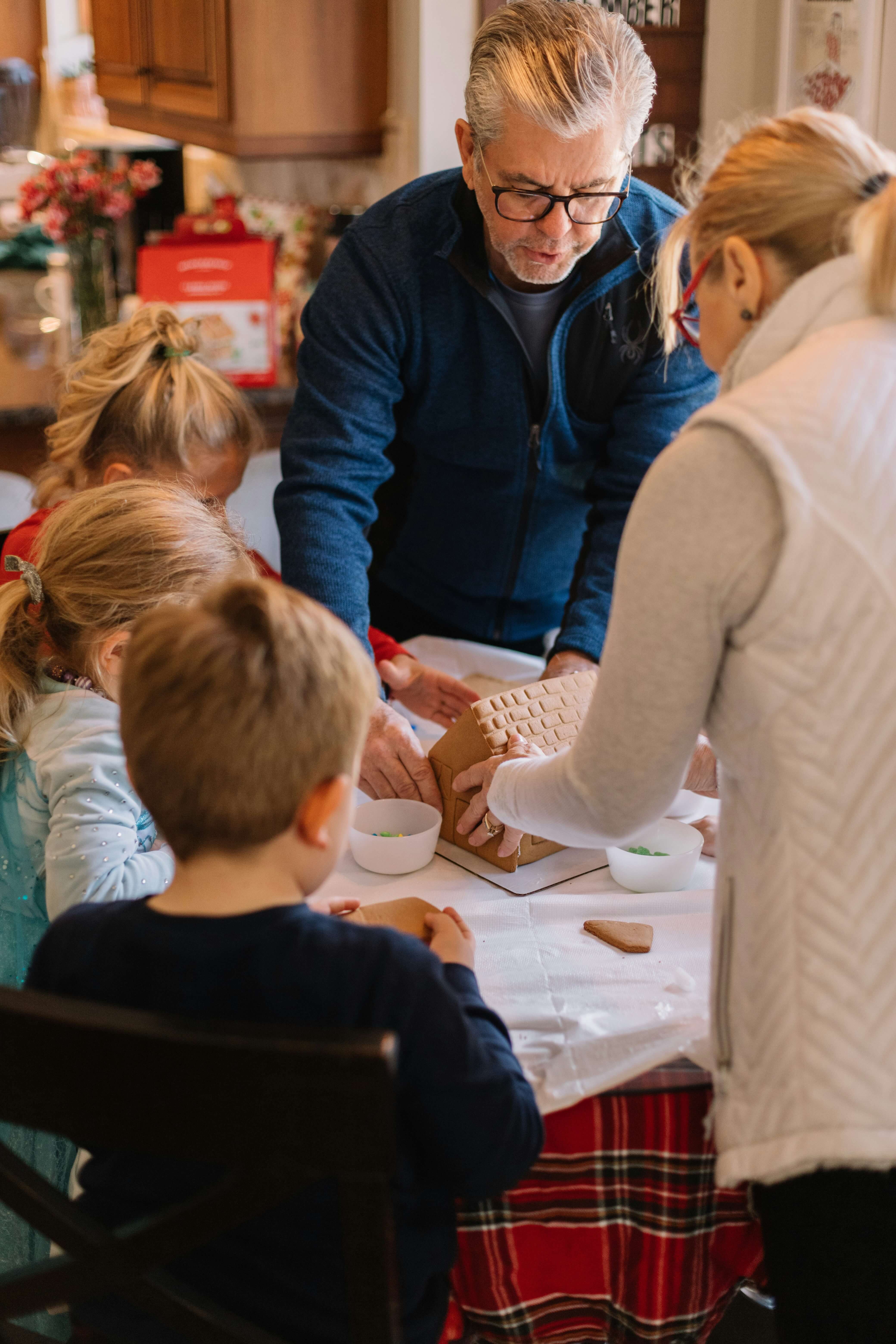 Grandparents doing craft with their granchildren