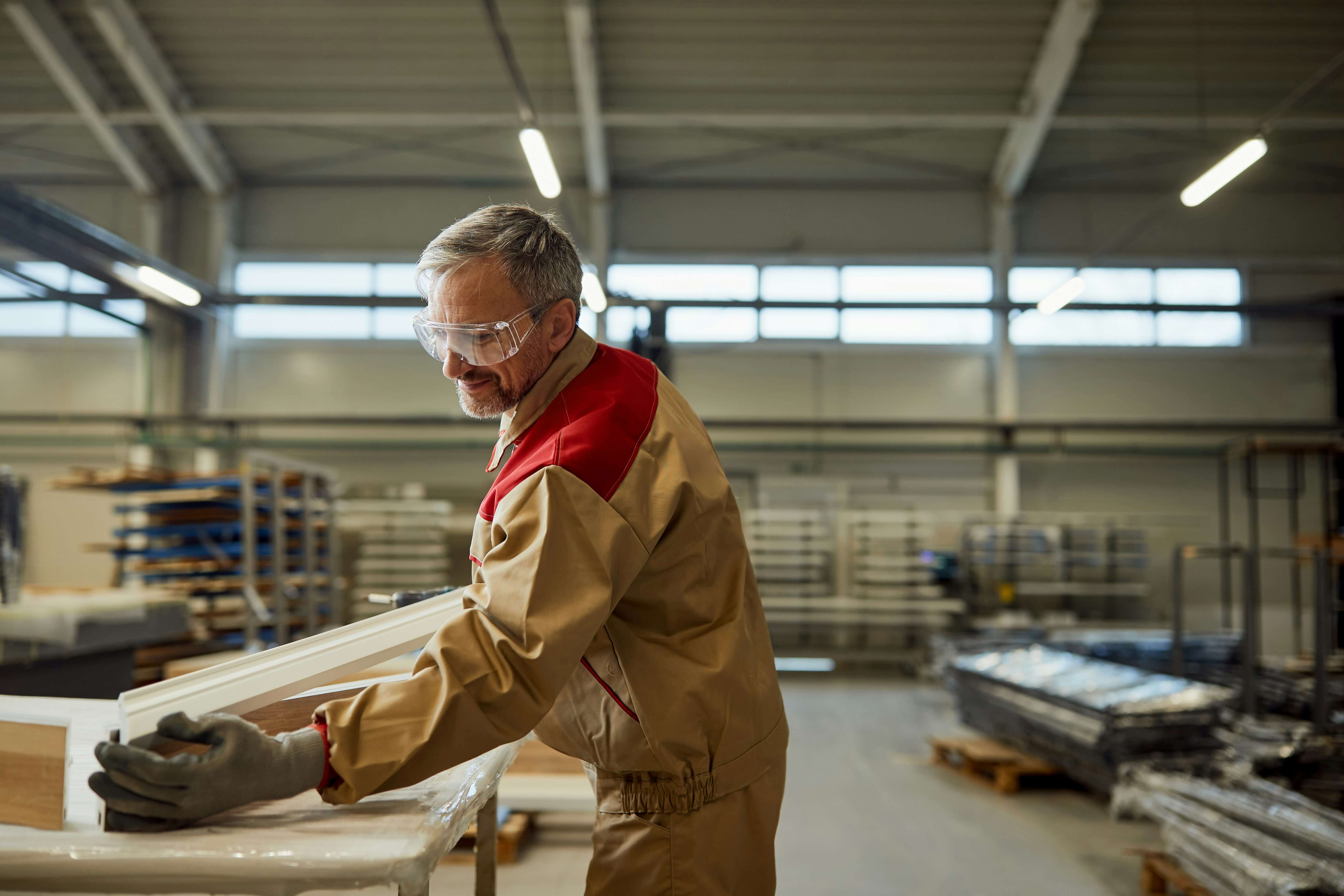 Older man working in a factory