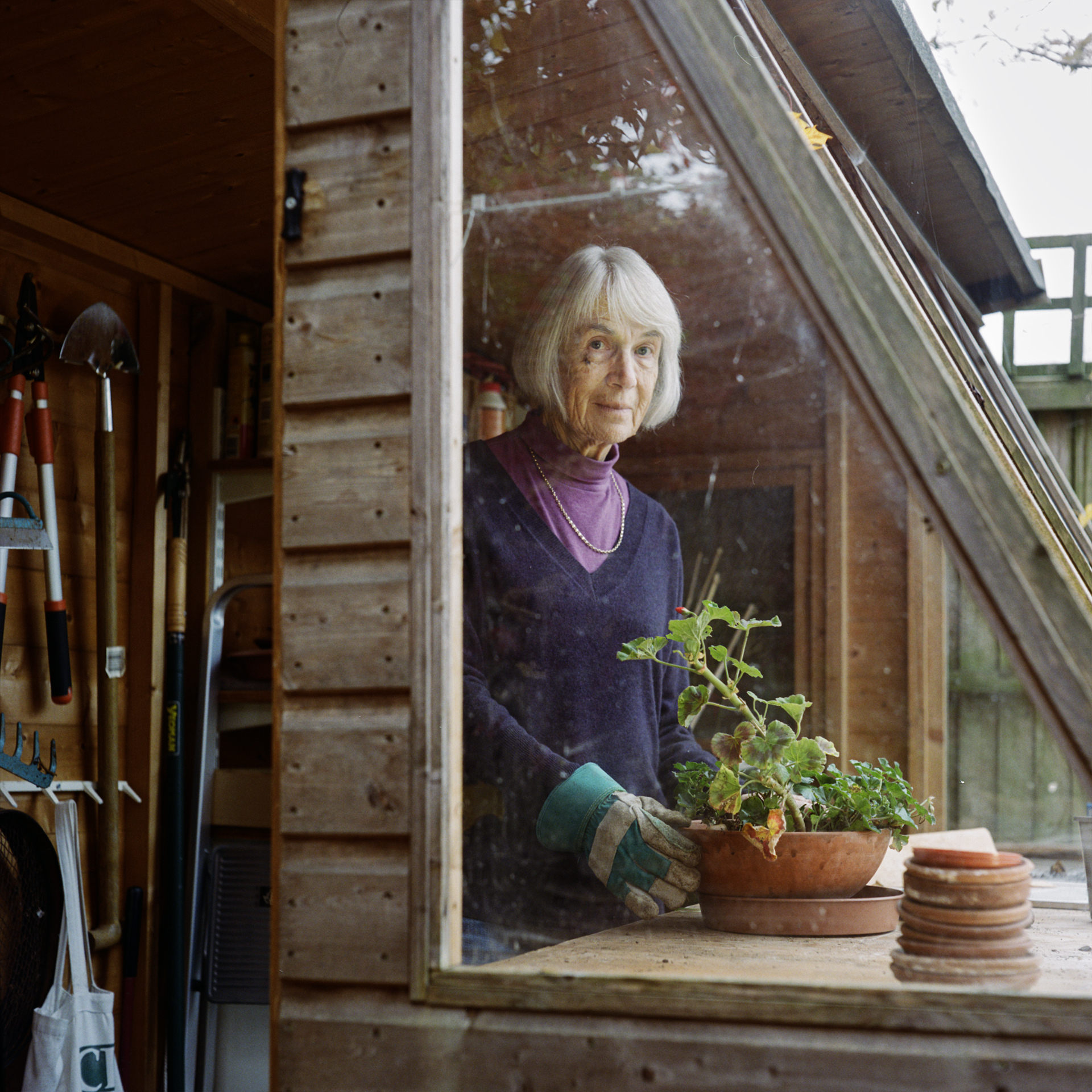A portrait of Jennifer in her potting shed, captured for the Voice advertising campaign. Photography by Rosie Barnes.