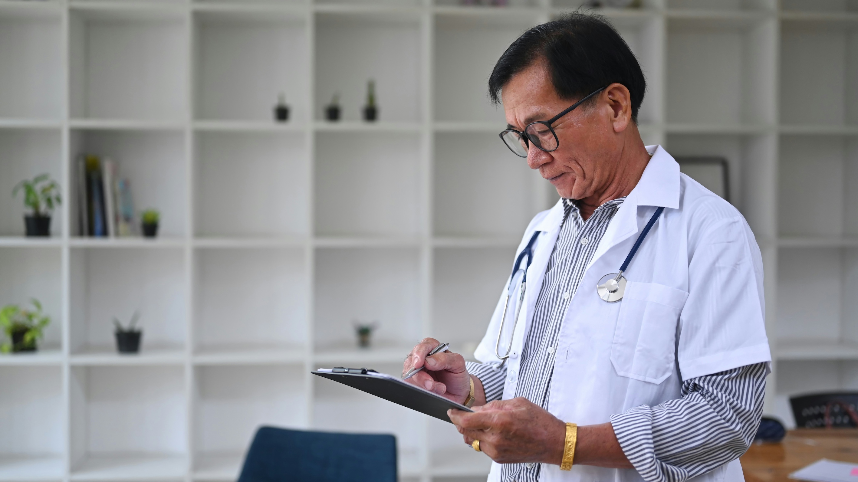 A doctor writing a prescription.