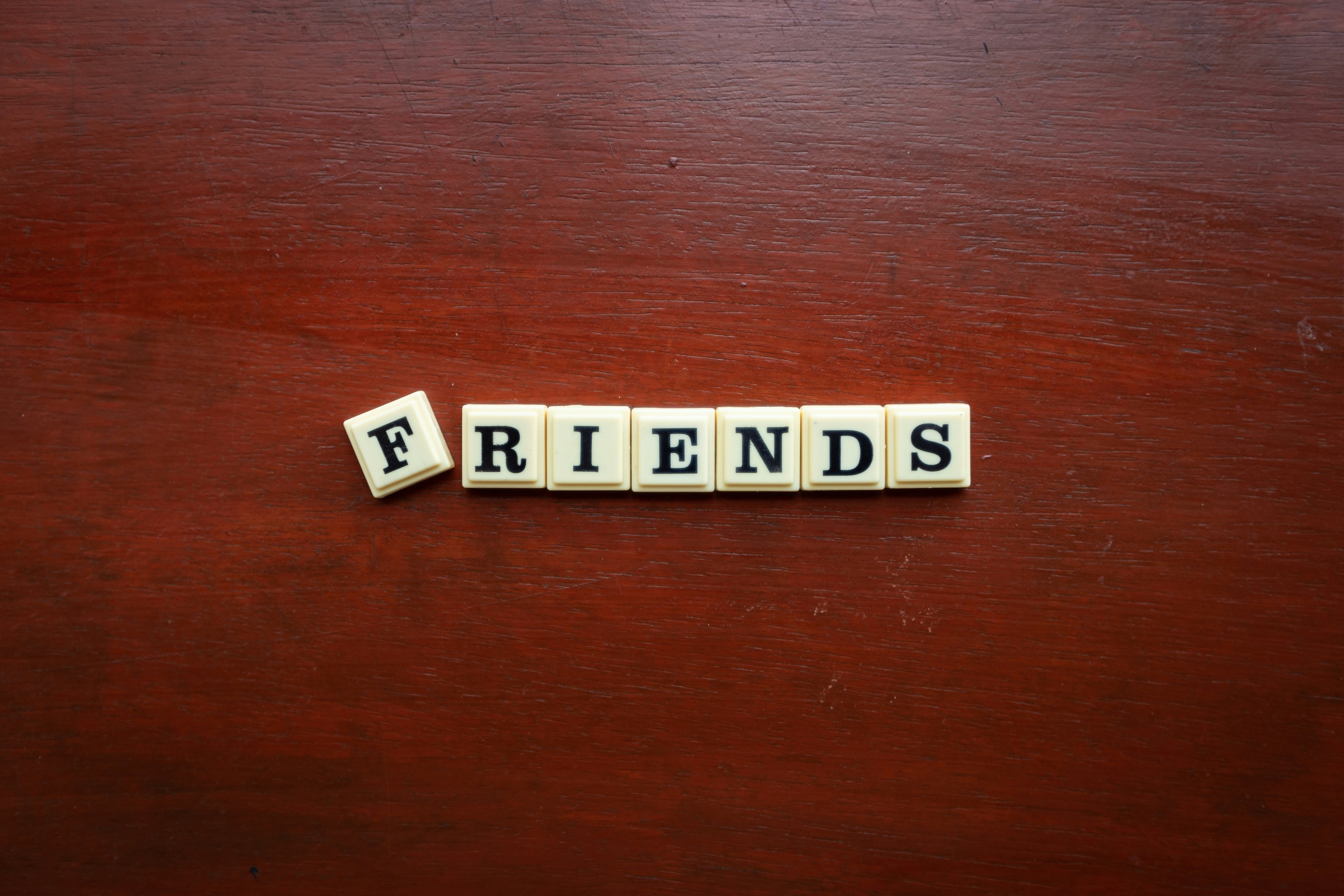Scrabble tiles reading friends