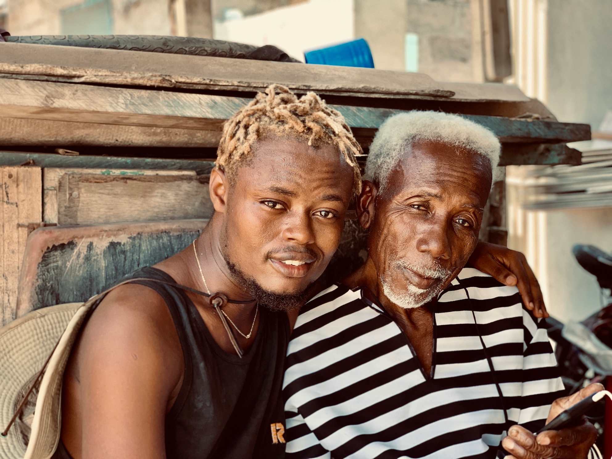 Younger man and older man smiling at the camera