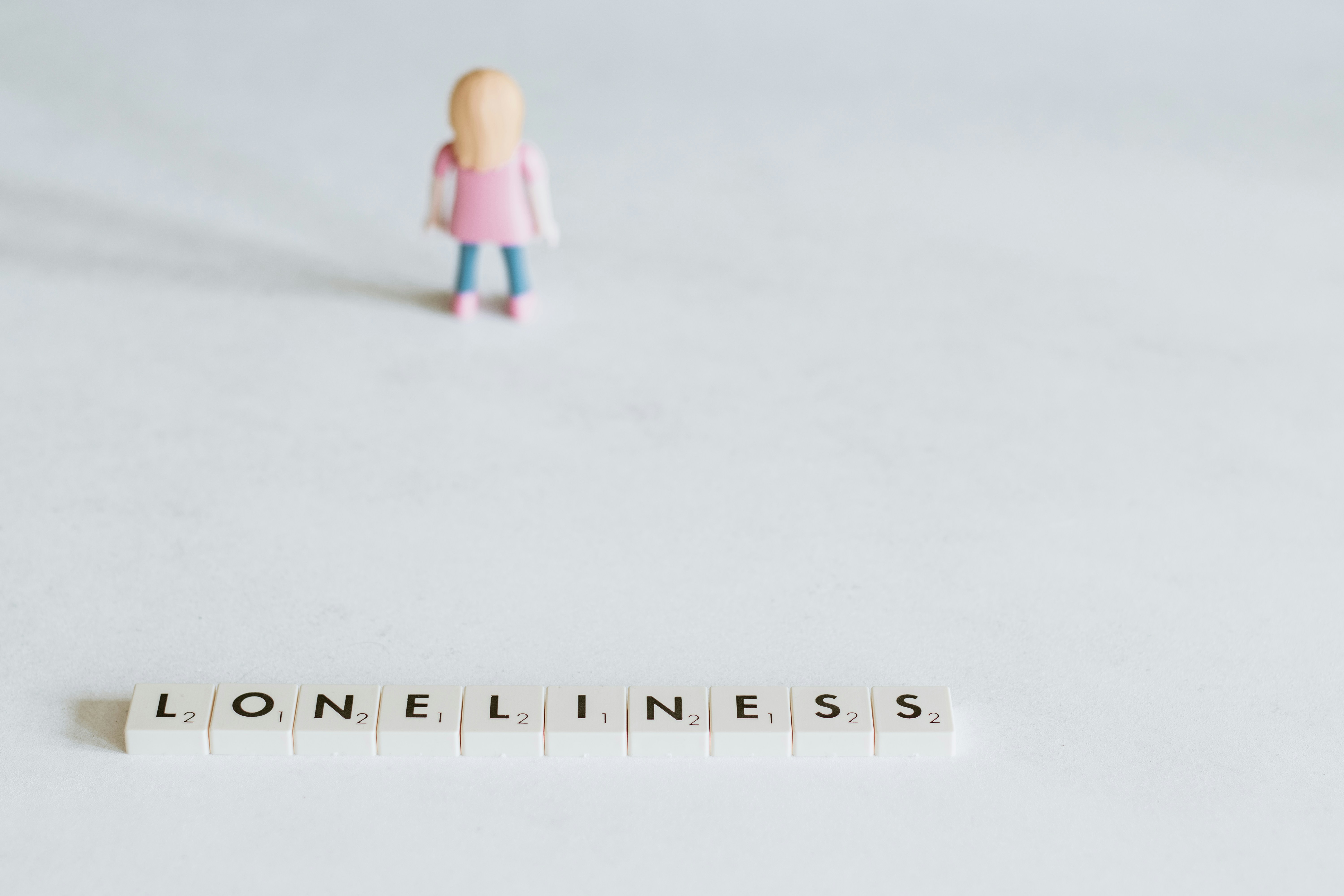 Scrabble tiles reading Loneliness