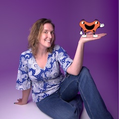 Suzanne with a cartoon pelvis in her hand.