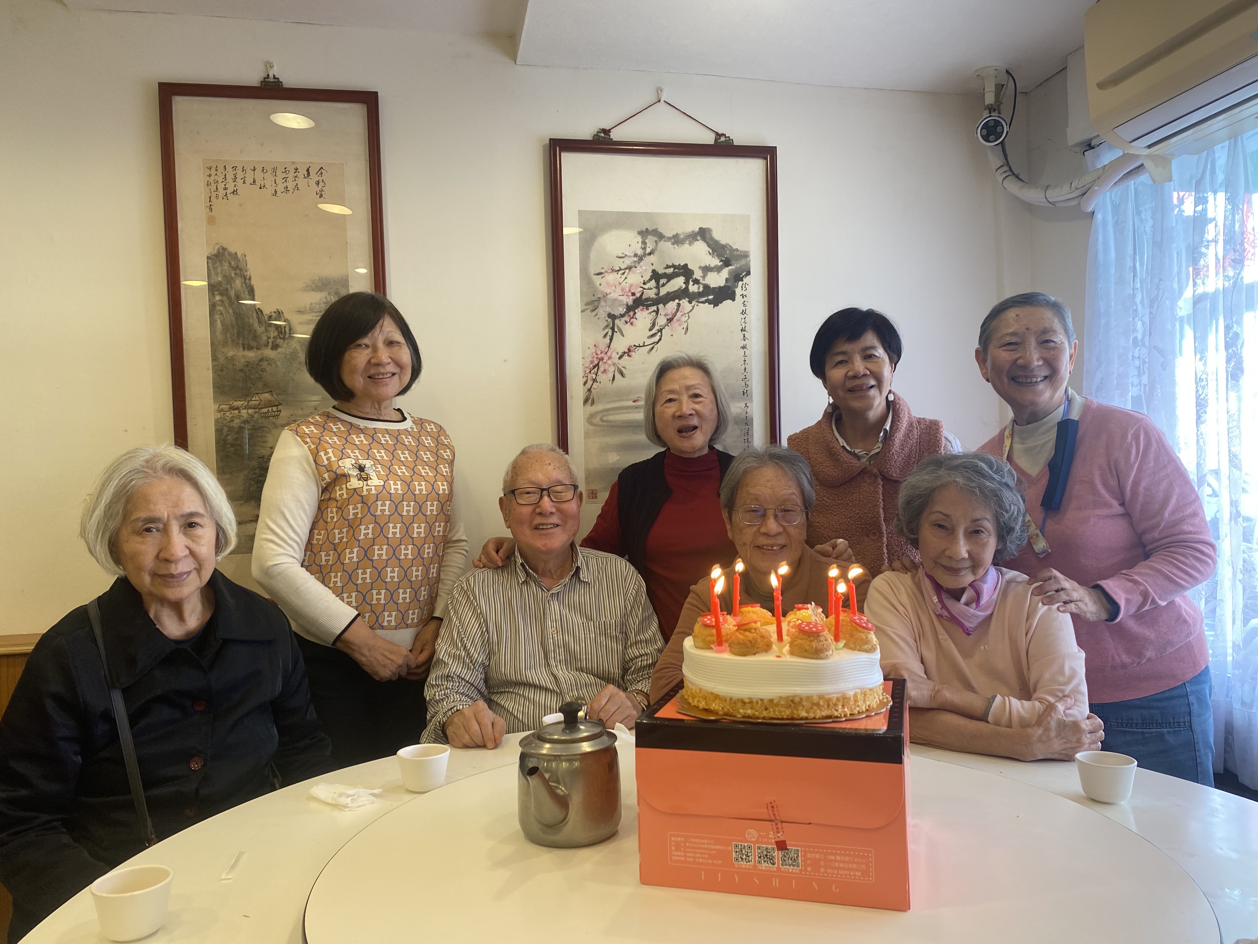Mrs. Chi celebrating her 80th birthday with friends.