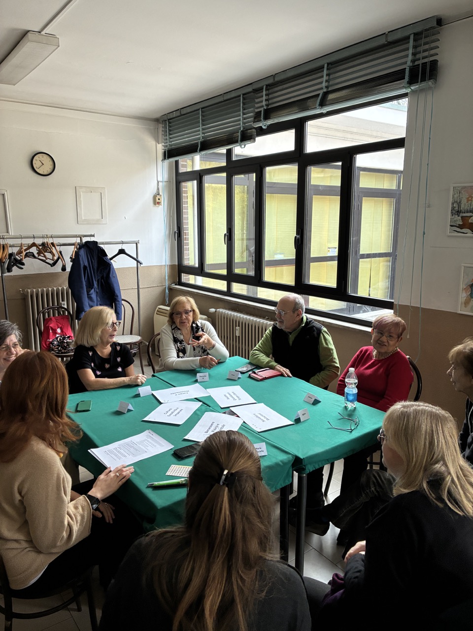 Voice members around a table in a workshop
