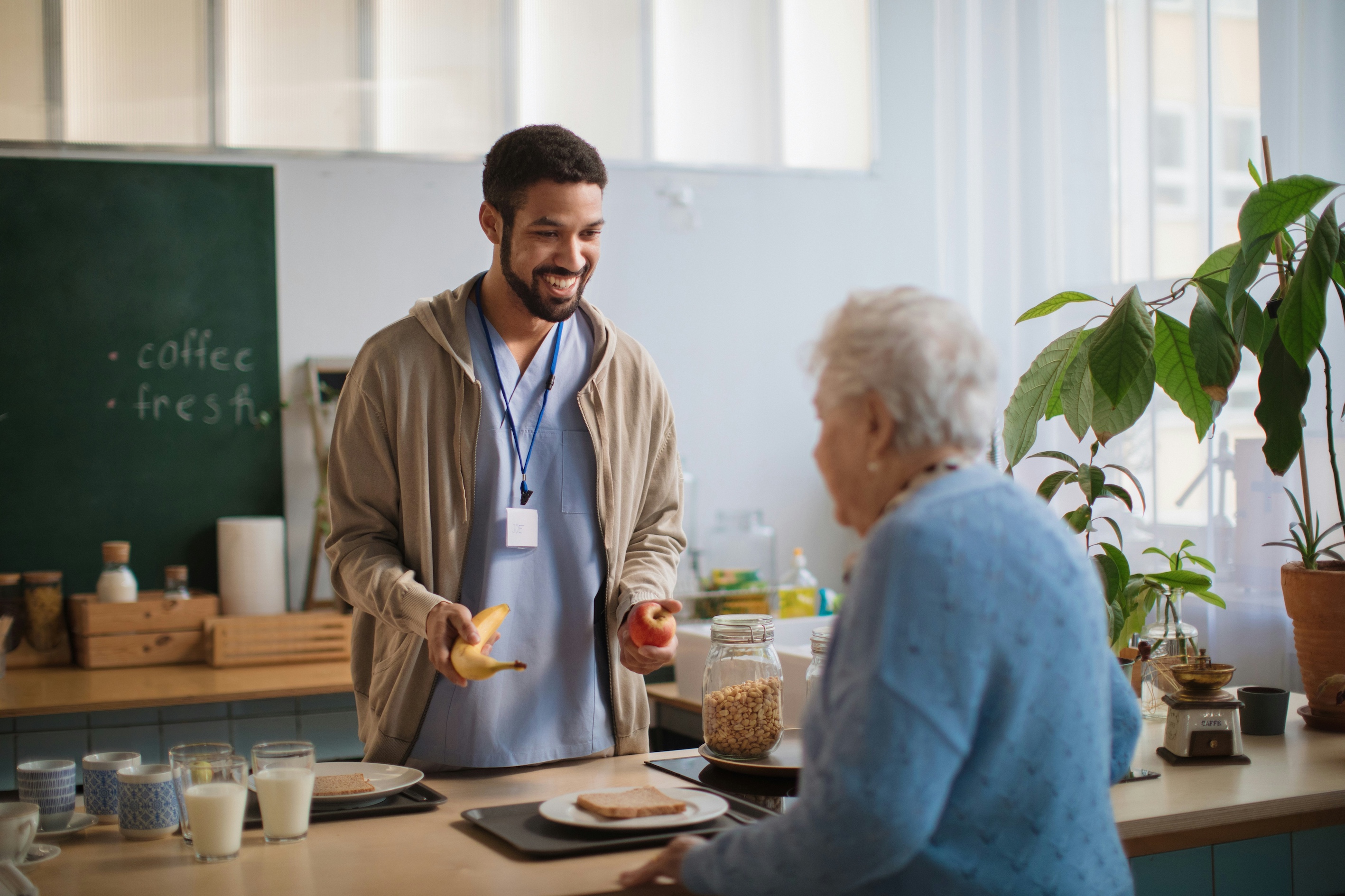 Older woman getting food at a food counter