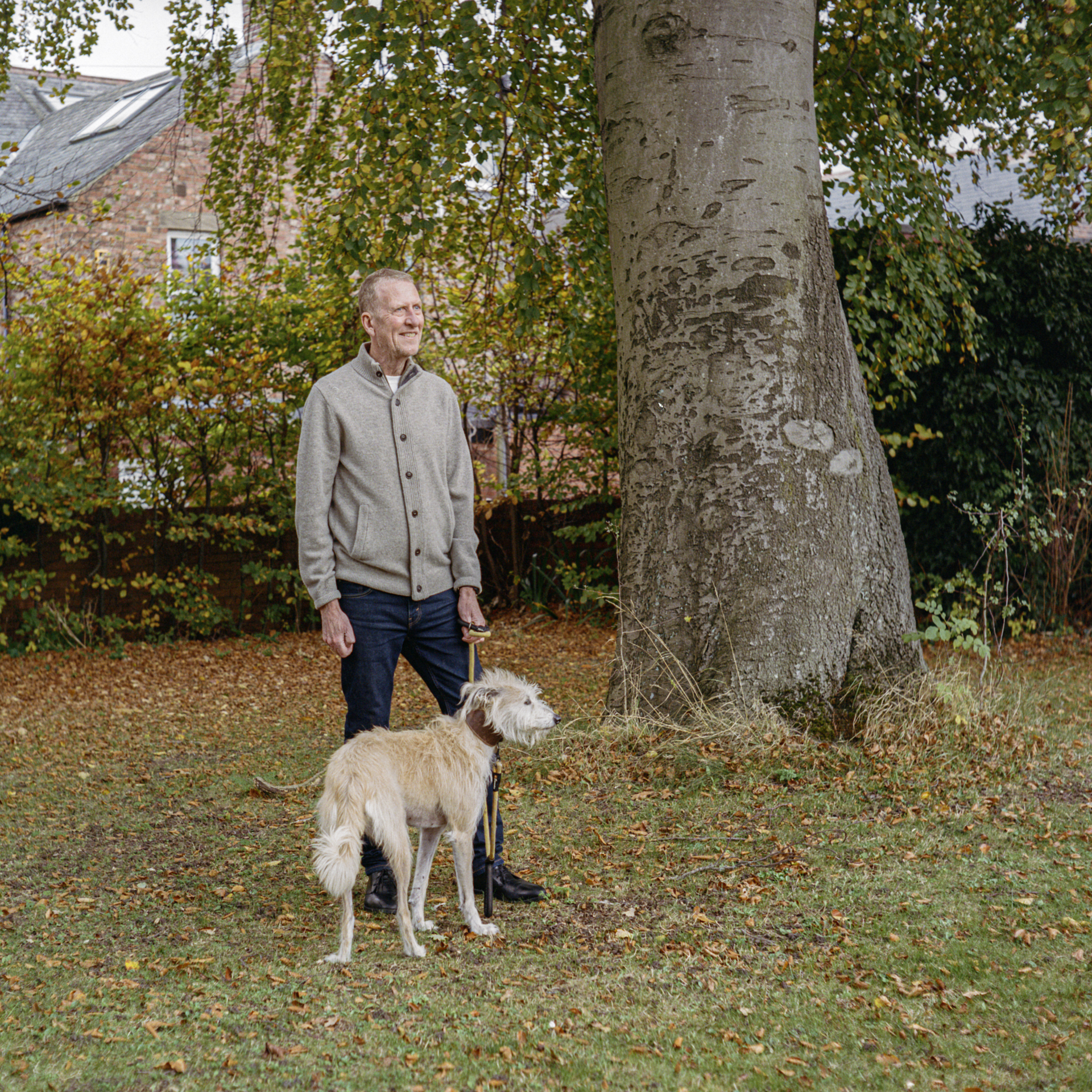 Mike with his dog outside.